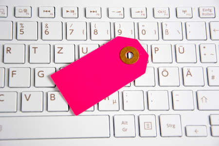 a paper tag on a keyboardの写真素材