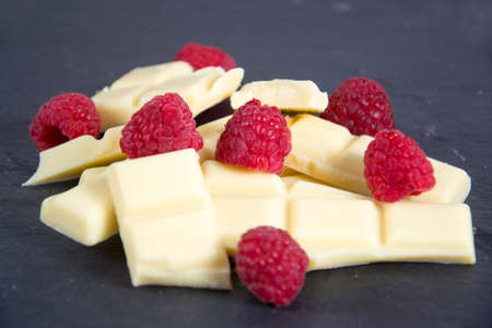 some broken chocolate with raspberry