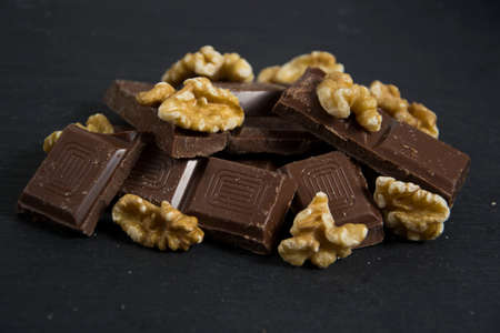 some broken chocolate with walnutの写真素材