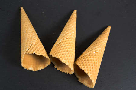 three empty ice cream waffersの写真素材