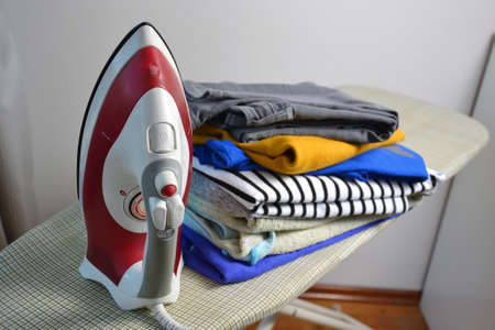 an iron with ironed laundry