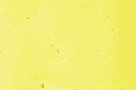 Yellow pocked texture of a cement wall in the streetの写真素材