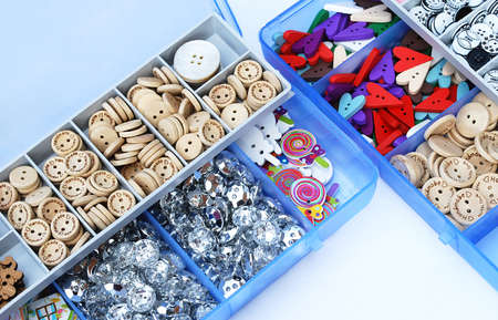 organizer with bright decorative buttons for needlework