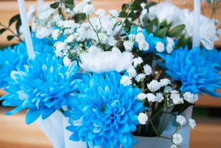 bright blue chrysanthemums in a bouquet with white carnationsの写真素材