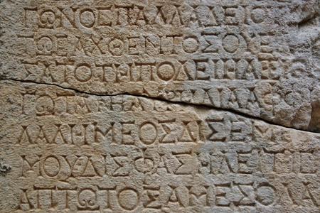 Old letters on the stone in Phaselis, Turkeyの写真素材