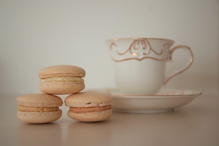 Macarons with Cup of tea on white backgroundの写真素材
