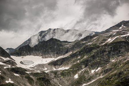 Mountain top covered with clouds, Alps, Austriaの写真素材