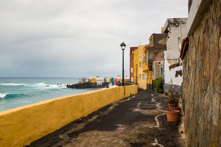 View of colourful houses of Punta Brava from beach in Puerto de la Cruz, Tenerife, Canary Islands, Spainの写真素材