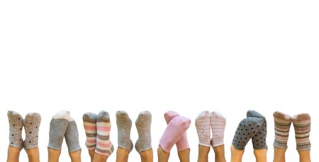 Female legs in colorful socks isolated on white, backgroundの写真素材