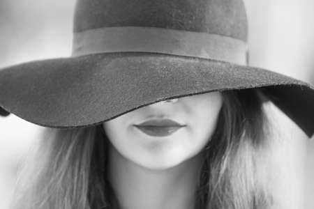 Sexy young pretty woman with red lips in vintage retro hat closeupの写真素材