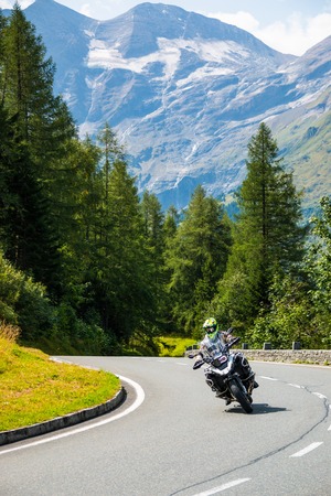 ALPS, AUSTRIA - 27.08.2017: Motorcycle on Country road to Grossglockner at the european alps in Austriaのeditorial素材