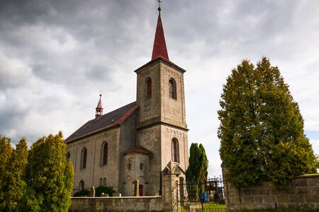 Beautiful old catholic church in rainy dayの写真素材