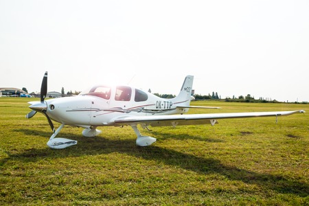 PRAGUE, CZECH REPUBLIC - 9.09.2017: White Propeller plane parking at the airport in Sunny day,...