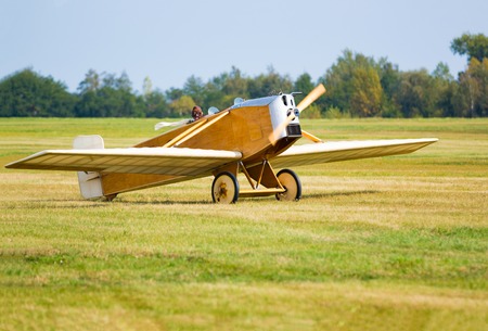 Vintage yellow airplane in airport