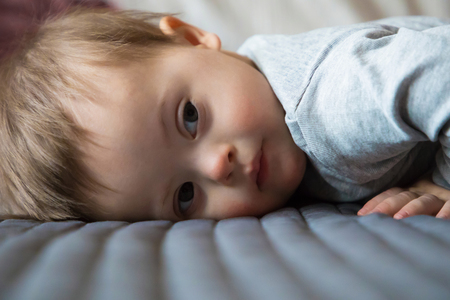 Portrait of cute baby boy with Down syndromeの写真素材
