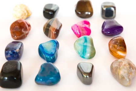 Collection of colorful semiprecious gemstones on white backgroundの写真素材
