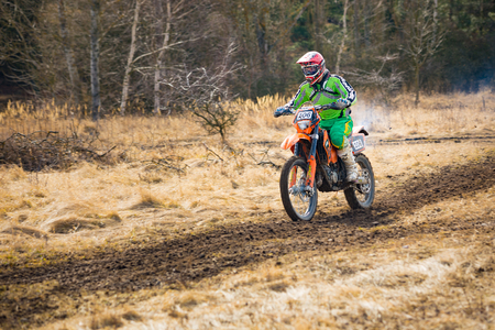 Pribram, Czech republic - 11.03.2018: Motocross rider in action on the off-road in nature next to small czech town Pribramのeditorial素材