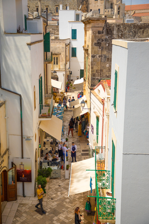 Otranto, Italy - 6.05.2018: People on Narrow streets of the old town in Otranto, Small typical alleys, Italyのeditorial素材
