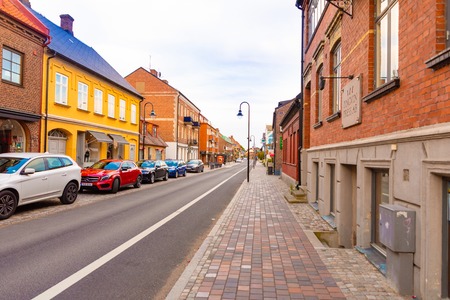 Raa, Sweden - 17.06.2018: Beautiful houses on Raavagen street with no people in evening in small town Raa - old fishing village located in southern Swedenのeditorial素材