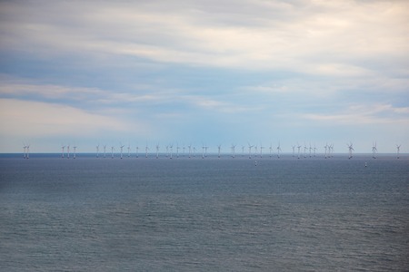 Offshore Windmill farm in the ocean Westermeerwind park in Denmark