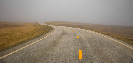 Beautiful road to Nordkapp in fog, the northern part of Norwayの写真素材