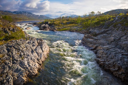 a beautiful norwegian river - nord europe travelの写真素材