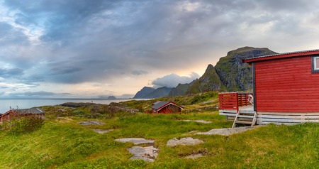 Traditional red camping houses with a beautiful sea view next to village A in lofoten, Norwayの写真素材