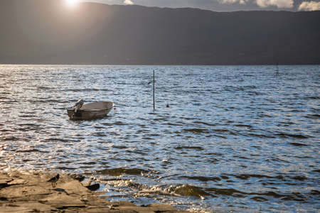 Small fishing boat floating in Norway fjord