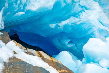 Blue ice cave of Svartisen Glacier in Norway