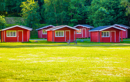 Riksveg, Norway - 25.06.2018: Red camping cabins for travelers in camping Riksveg, Norwayのeditorial素材