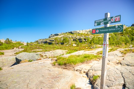 Preikestolen, Norway - 30.06.2018: Signpost showing direction and distance to Preikestolen, or Pulpit Rock on Lysefjord in Norwayのeditorial素材