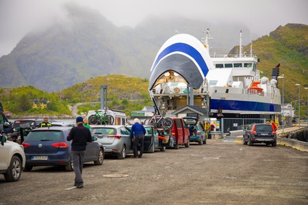 Sorvagen, Norway - 22.06.2018: Passenger ferry ship in harbor and cars waiting boarding in Norwayのeditorial素材