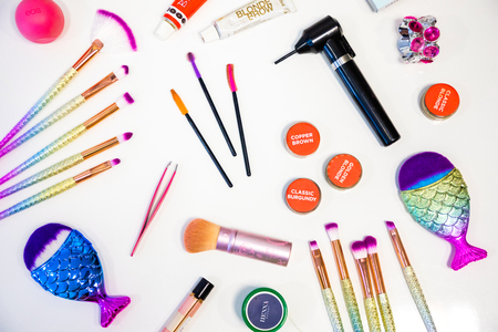 Prague, Czech Republic - 5.08.2018: Professional makeup tools and brushes. Flat composition. magazines and social media. Top view. Flat lay.のeditorial素材