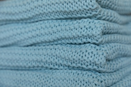 Warm and cozy Handmade blue knitted blankets, texture background