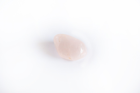 Natural gemstone, rose quartz mineral gem stone isolated on white background