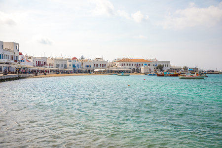 Mykonos, Greece - 17.10.2018: Port of Mykonos Town with white arhitecture and colorfull boats in Greeceのeditorial素材