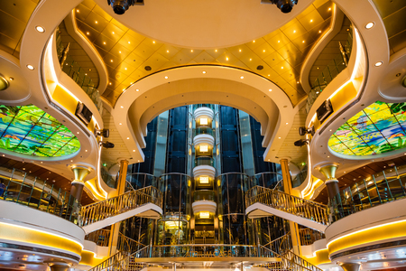 Mediterranean sea, Greece - 16.10.2018: Interior of The Atrium of Cruise Ship Norwegian Star with people during a cruise to Greeceのeditorial素材