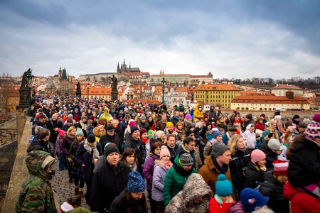Prague, Czech Republic - 6.01.2019: A lot of people on Charles Bridge in winter day in Prague in Czech Republic.のeditorial素材