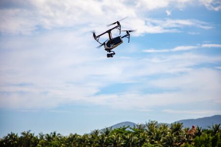 Sanya, Hainan Island, China - 22.06.2019: DJI Inspire - drone UAV quadcopter which shoots 4k video...