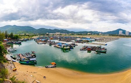 A fishing village of fishermans on the sea water in island Hainan, China