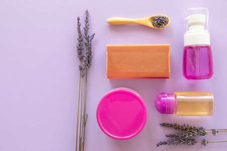 Lavender Soap, Lavande oil, lavander hydrolyte and bouquet on violet background, Homemade cosmetics, and Beauty Conceptの写真素材