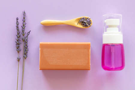 Lavender Soap, lavander hydrolyte and bouquet on violet background, Homemade cosmetics, and Beauty Conceptの写真素材