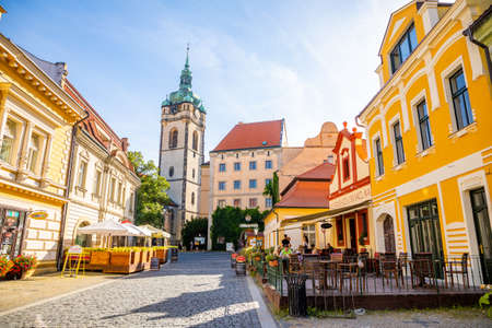Melnik, Czech Republic - 07/29/2020: City landscape, an old city street at sunset with numerous...
