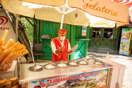 Antalya, Turkey - 4.09.2020: Traditional turkish ice cream seller in a summer day, Antalya, Turkey