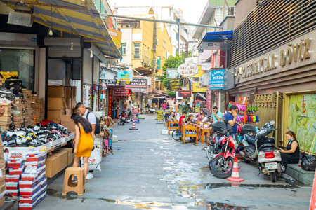 Antalya, Turkey - 7.09.2020: Street view in old town with boutique shops at evening. Kas Town is...