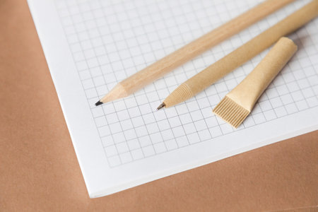 Reusable eco-friendly craft paper pen and pencil on the notebook. Writing ballpoint pen,...