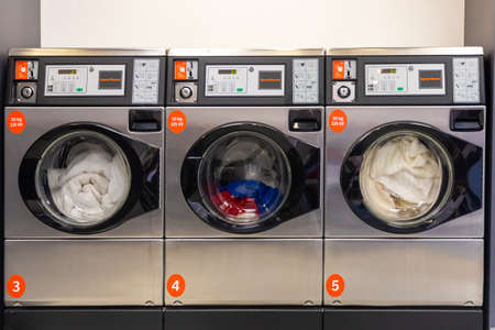 Prague, Czech Republic - 16.12.2020: A downtown rise laundry room with Speed Queen front load washers and dryers in Prague, Czech Republicのeditorial素材