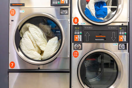 Prague, Czech Republic - 16.12.2020: A downtown rise laundry room with Speed Queen front load washers and dryers in Prague, Czech Republicのeditorial素材