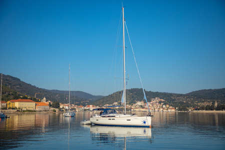 Vis, Croatia - 31.03.2021: luxury yacht in the marina at sunrise lights in Croatia
