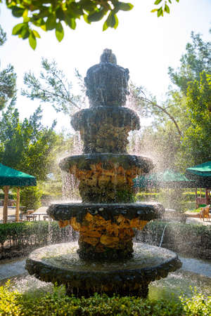 Antalya, Turkey - 15.09.2020: Fountain in garden restaurant with picnic and recreation area, traditional turkish breakfast place in Hacisekililer near Antalya, Turkeyのeditorial素材